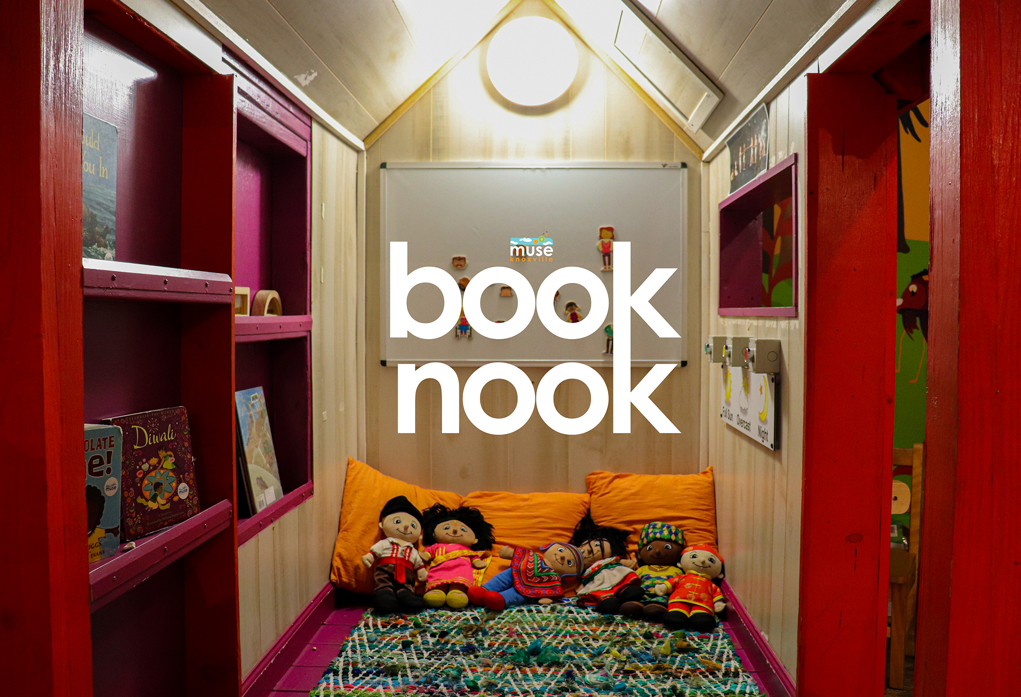 a book nook with stuffed animals on the floor